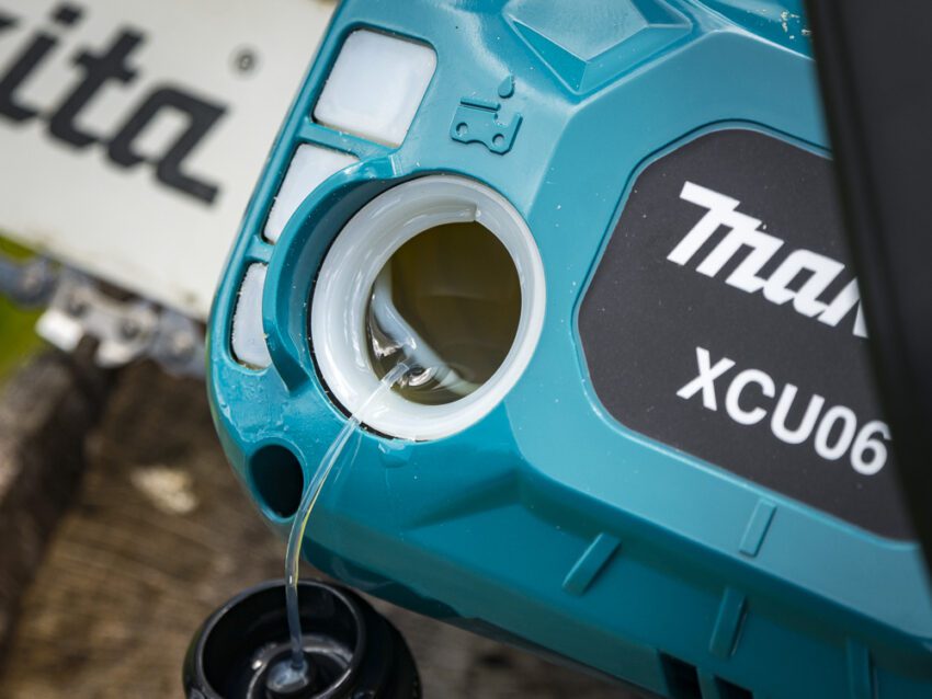 Makita chainsaw with oil filler cap removed