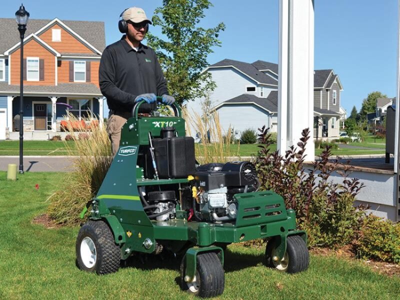 aerating and overseeding a lawn as part of fall lawn care