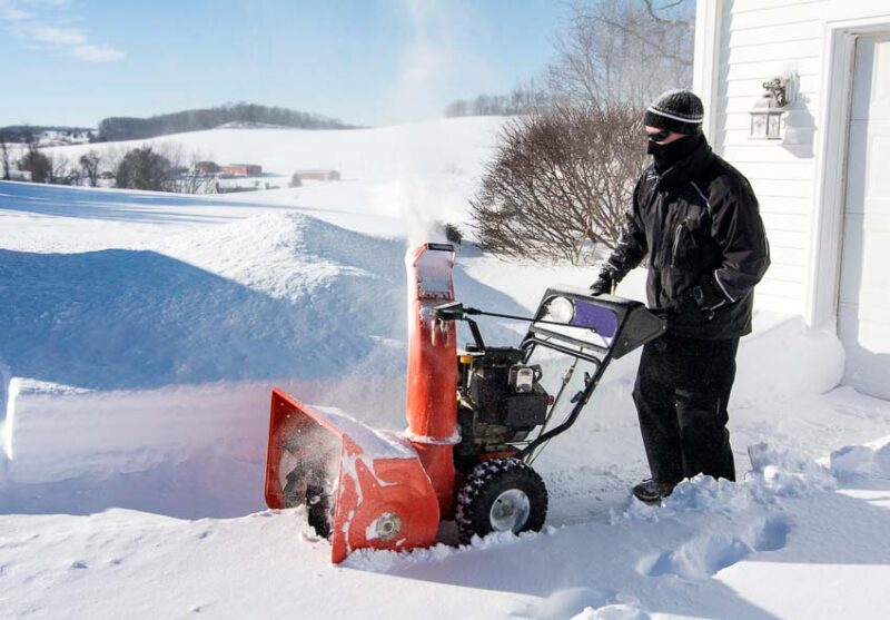 clearing driveways with a snow blower